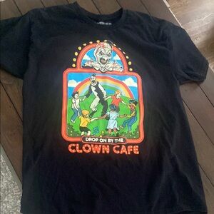 Terrifier Clown Café T Shirt - Steven
Rhodes